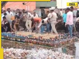 Watch: Police try to destroy liquor bottles worth Rs 50 lakh, locals steal them, video goes viral