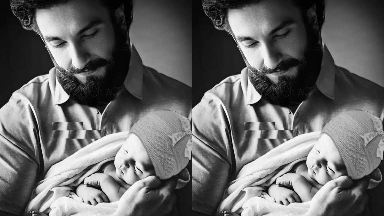 Ranveer Singh holds a newborn baby in his arms