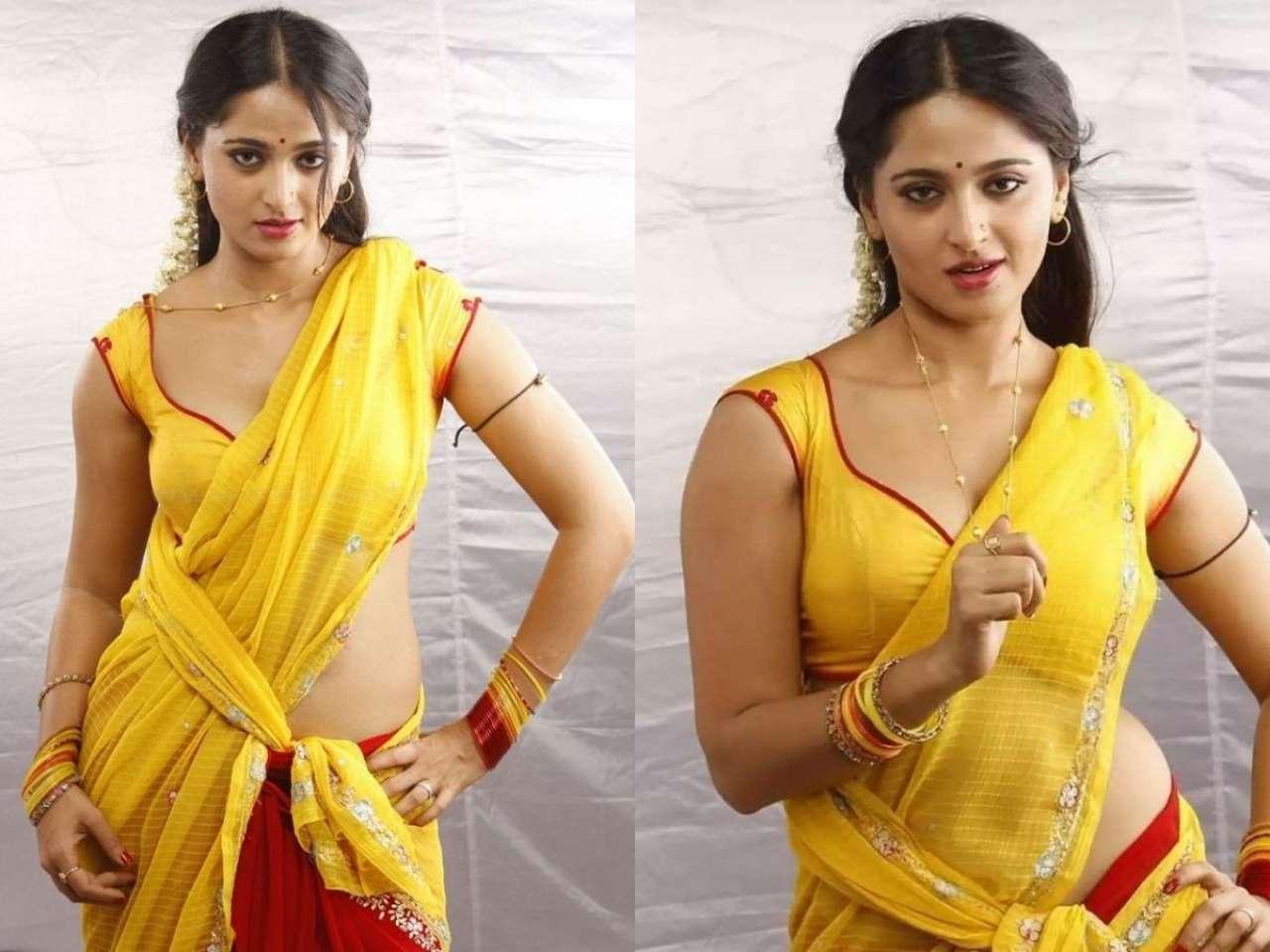 Anushka Shetty looks sexy in bright yellow saree